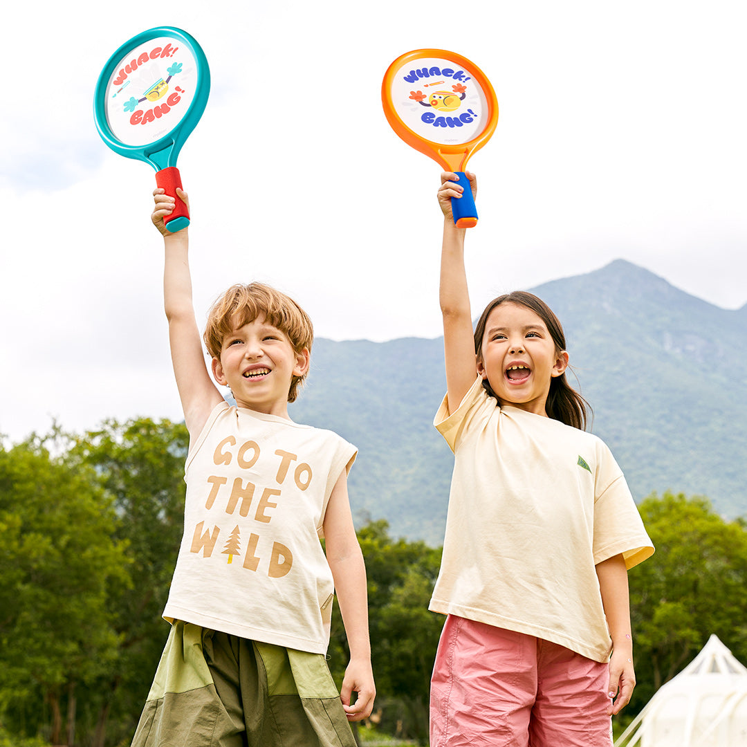 Two children happily playing with 2-in-1 Kids Entry-Level Racket set for tennis and badminton outdoors